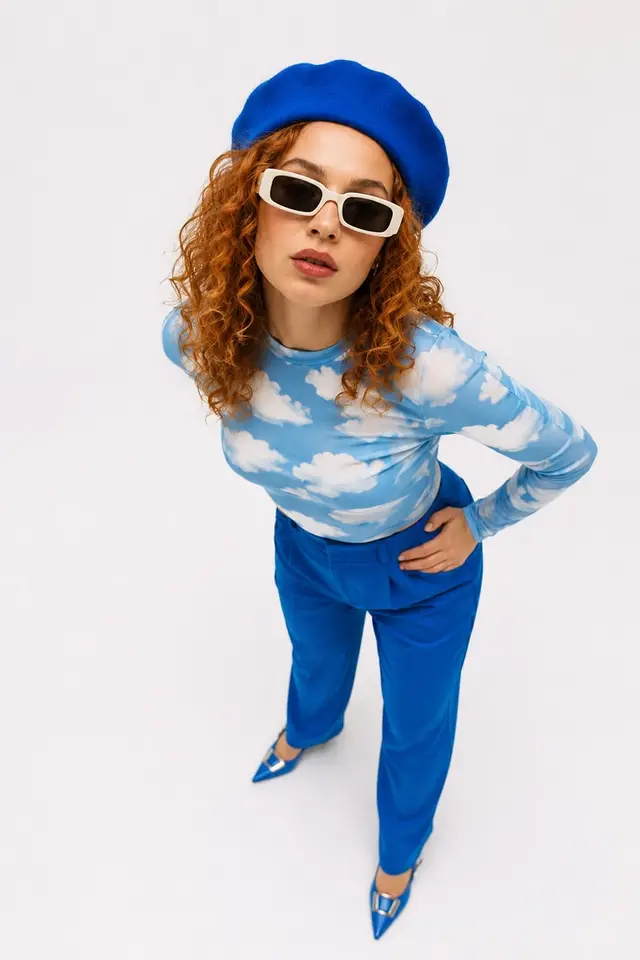 Cloud-print top with cobalt trousers and beret — fashion editorial